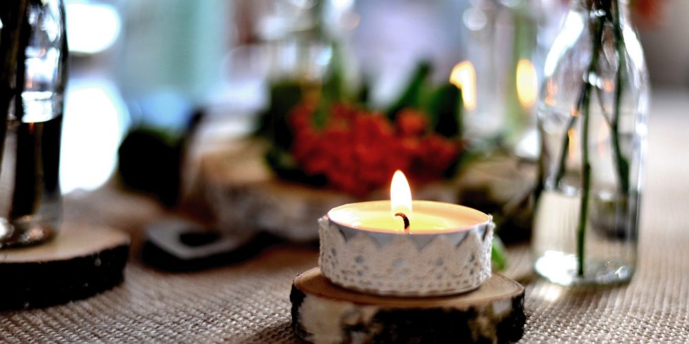 A candle burns to show gratitude