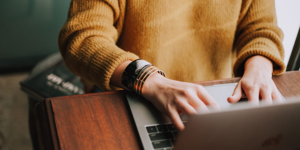 Coder or copywriter on their laptop