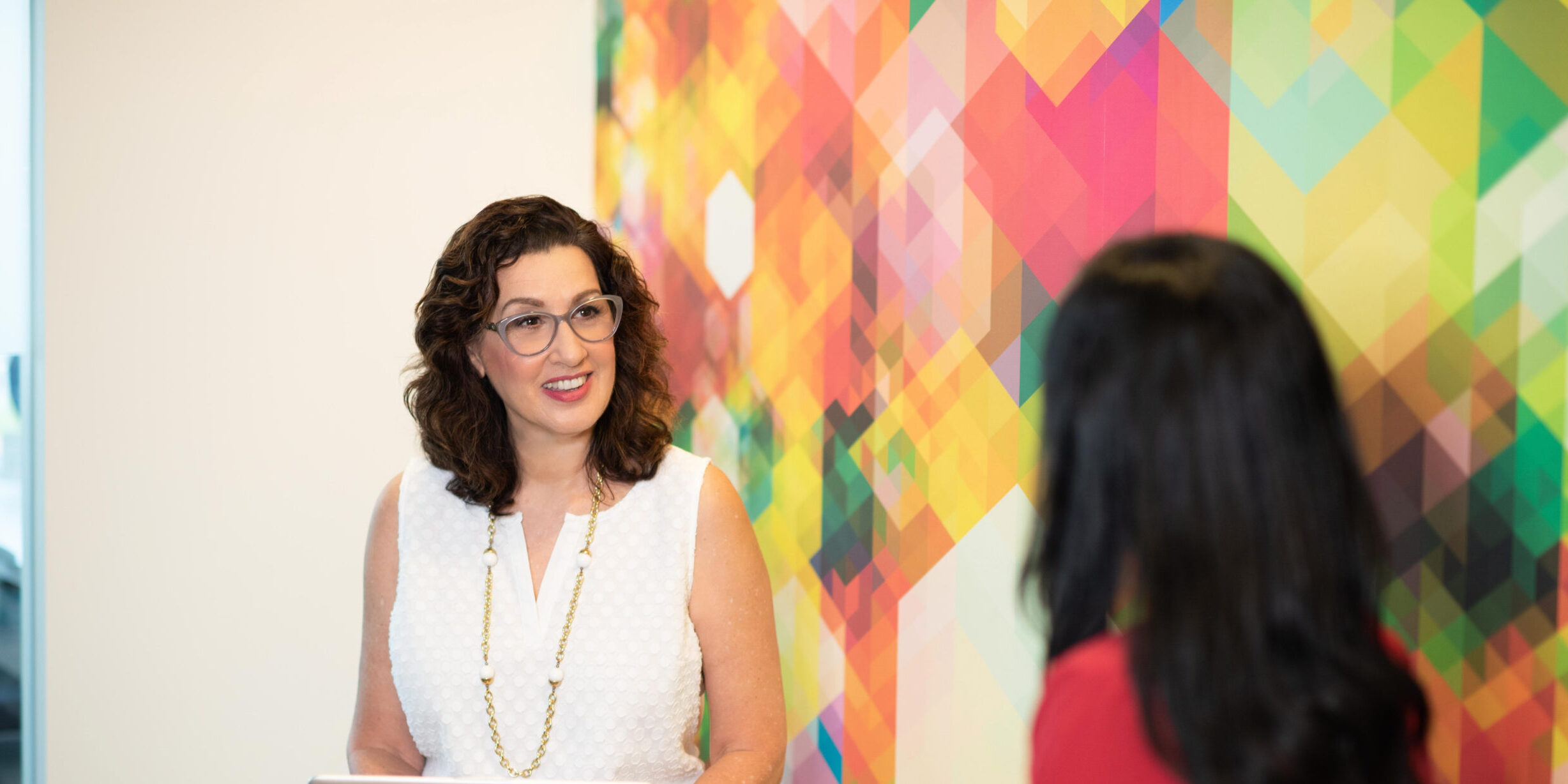 Janet-Granger-seated-w-client-hi-res-scaled